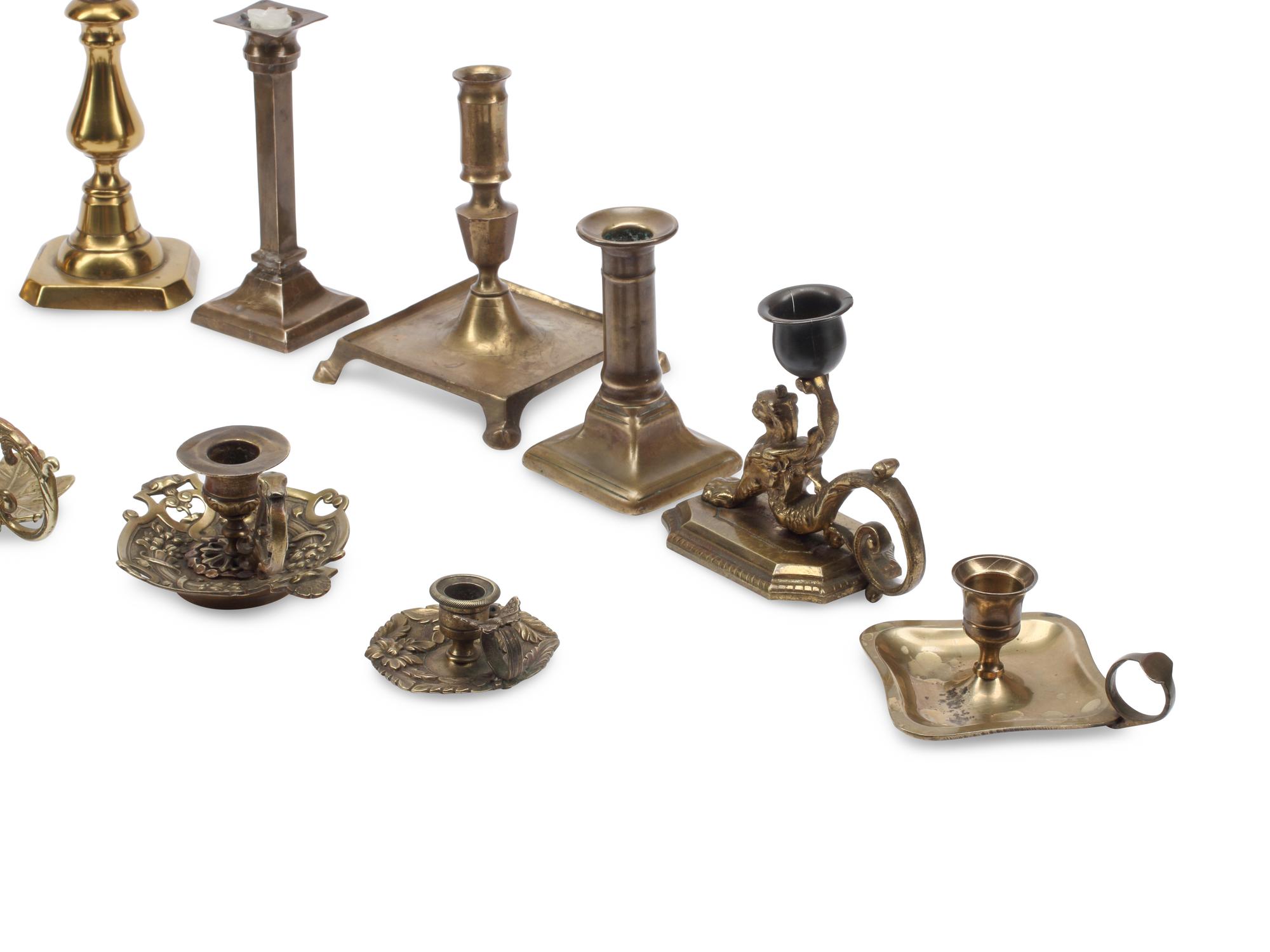A Collection of Brass Candlesticks