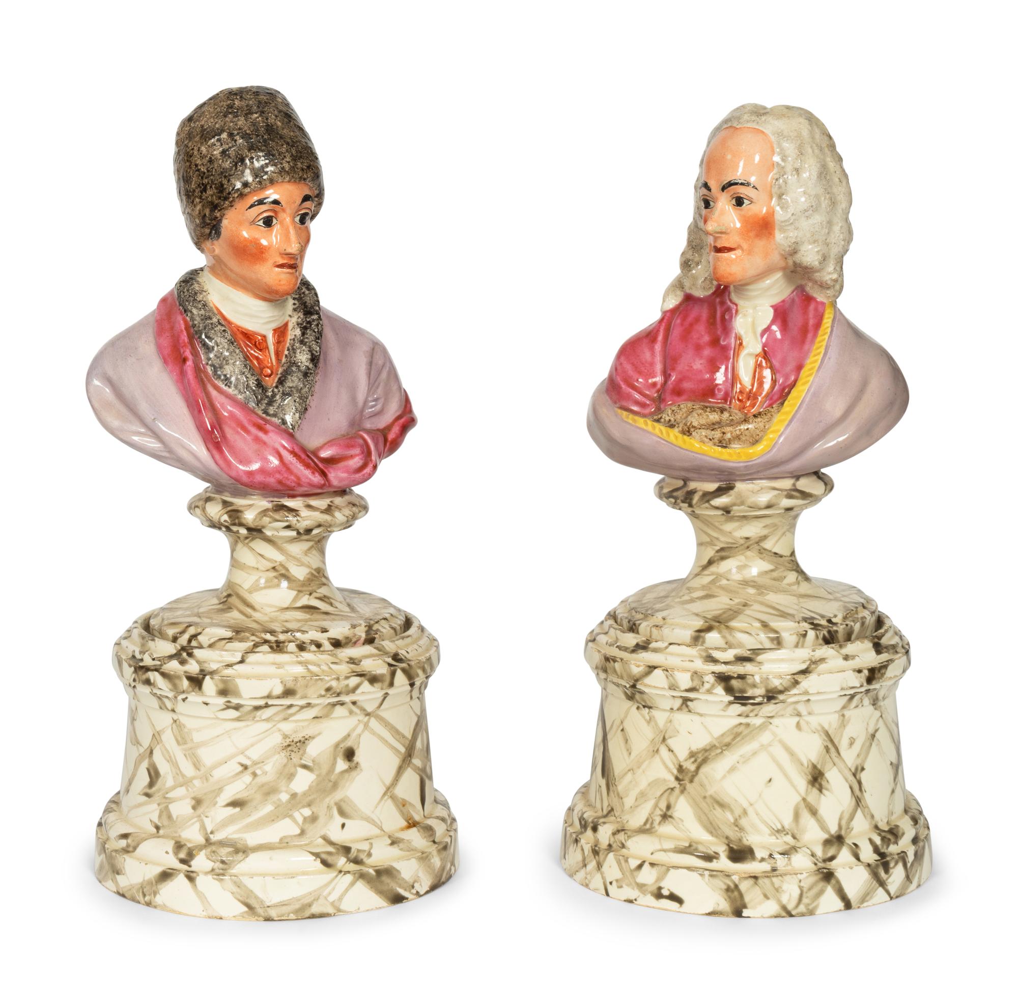 A Pair of French Faience Busts of Voltaire and Rousseau