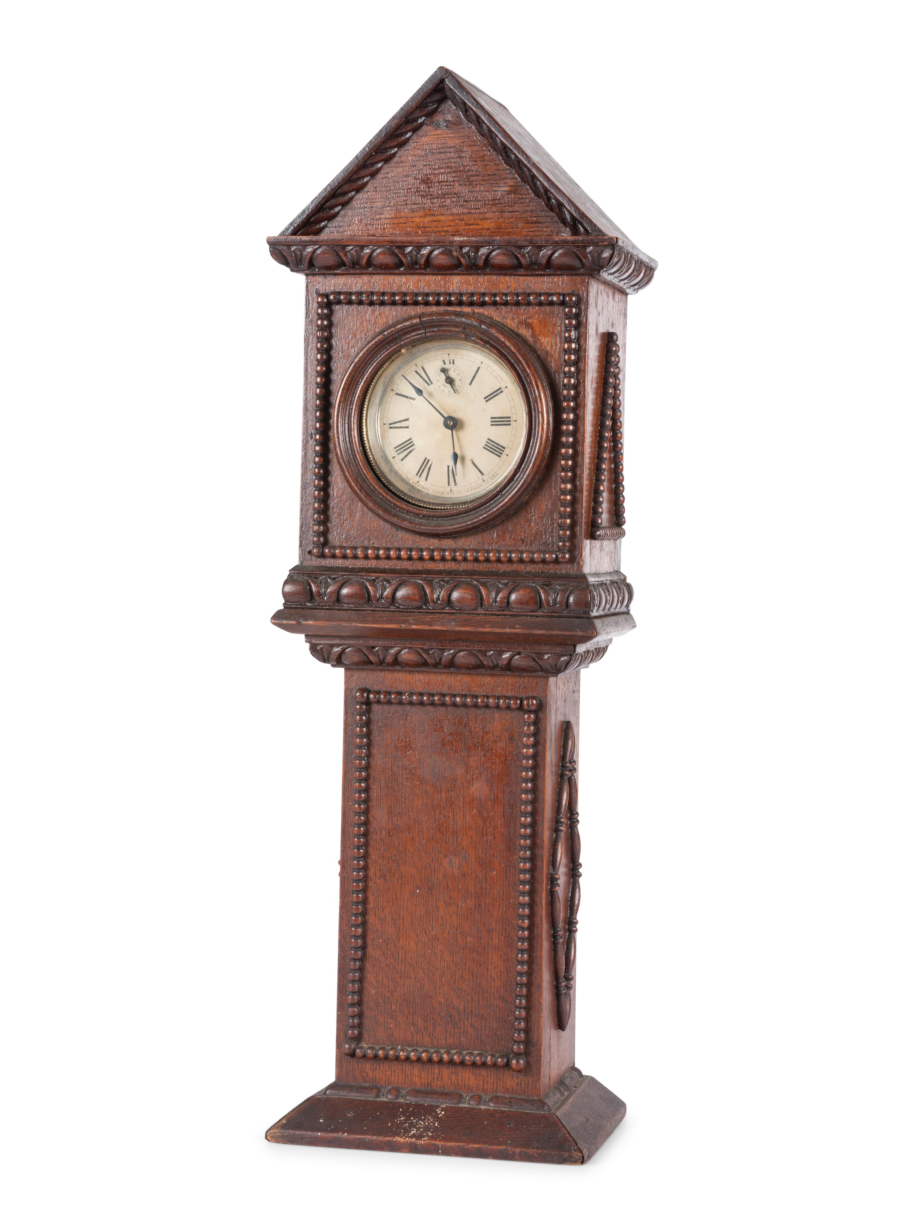 A Miniature Carved Tall Case Clock