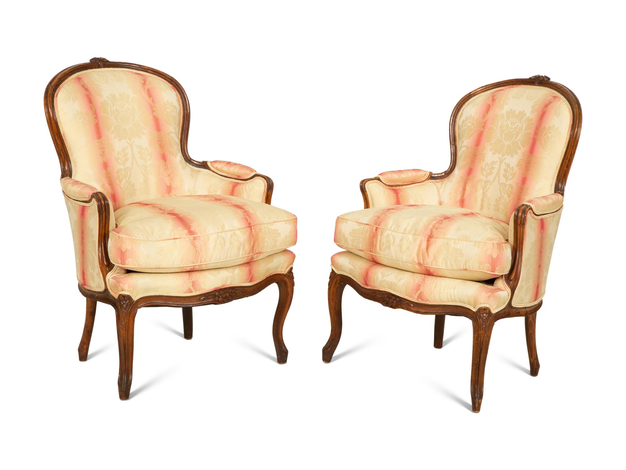 A Pair of Louis XV Style Walnut Bergères