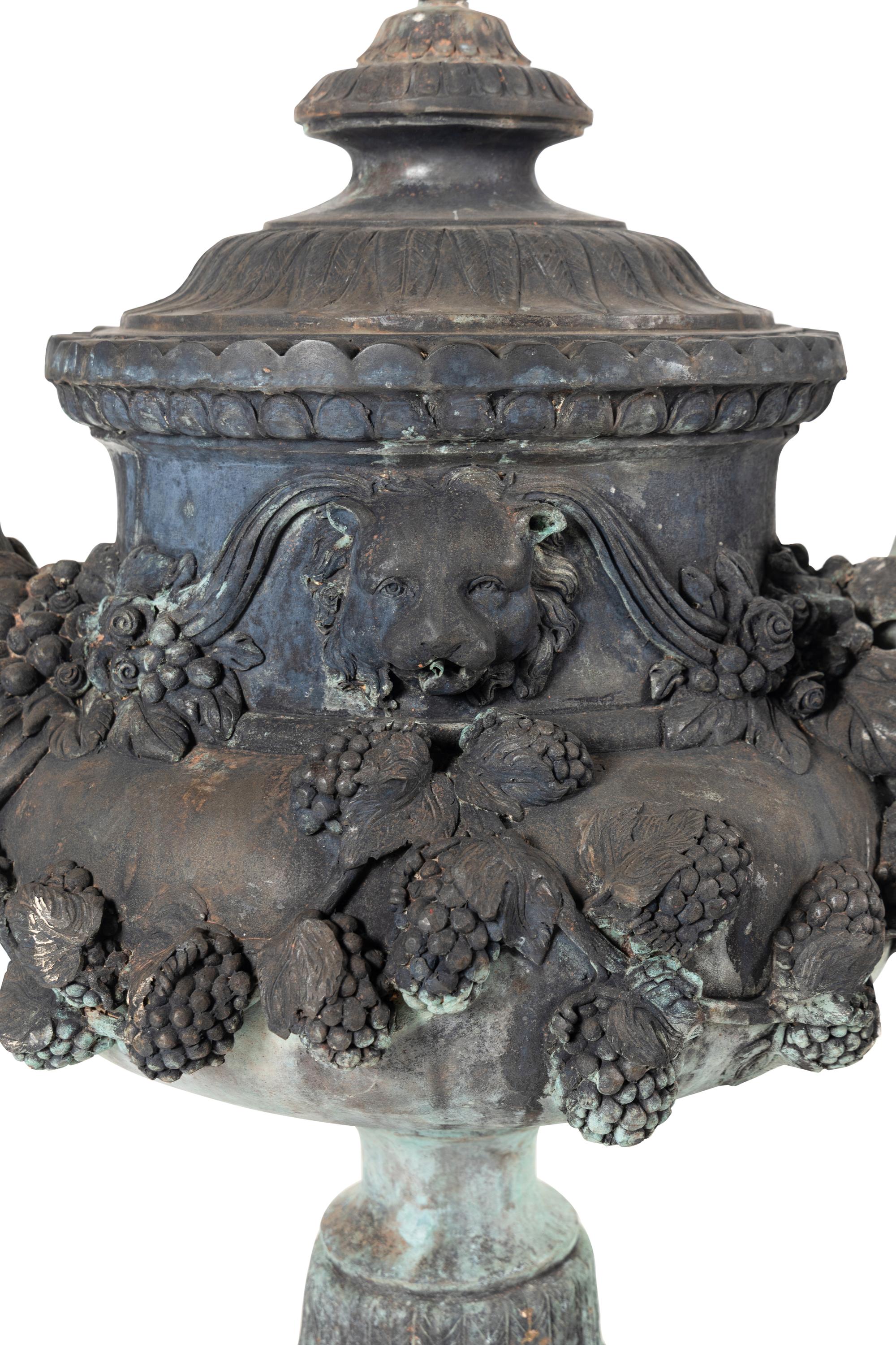 A Patinated Bronze Fountain Urn on Plinth