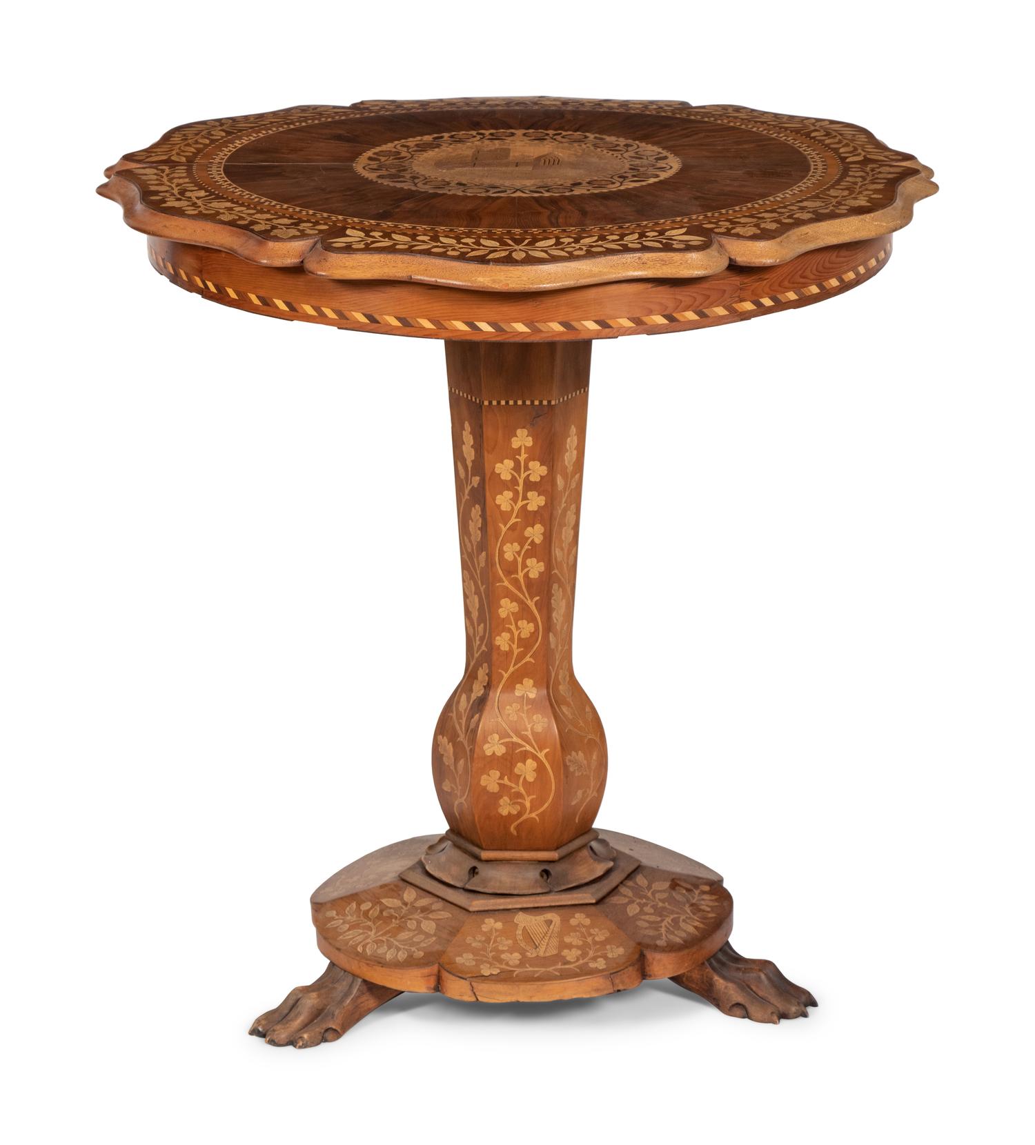 A Continental Marquetry Table on Claw Feet
