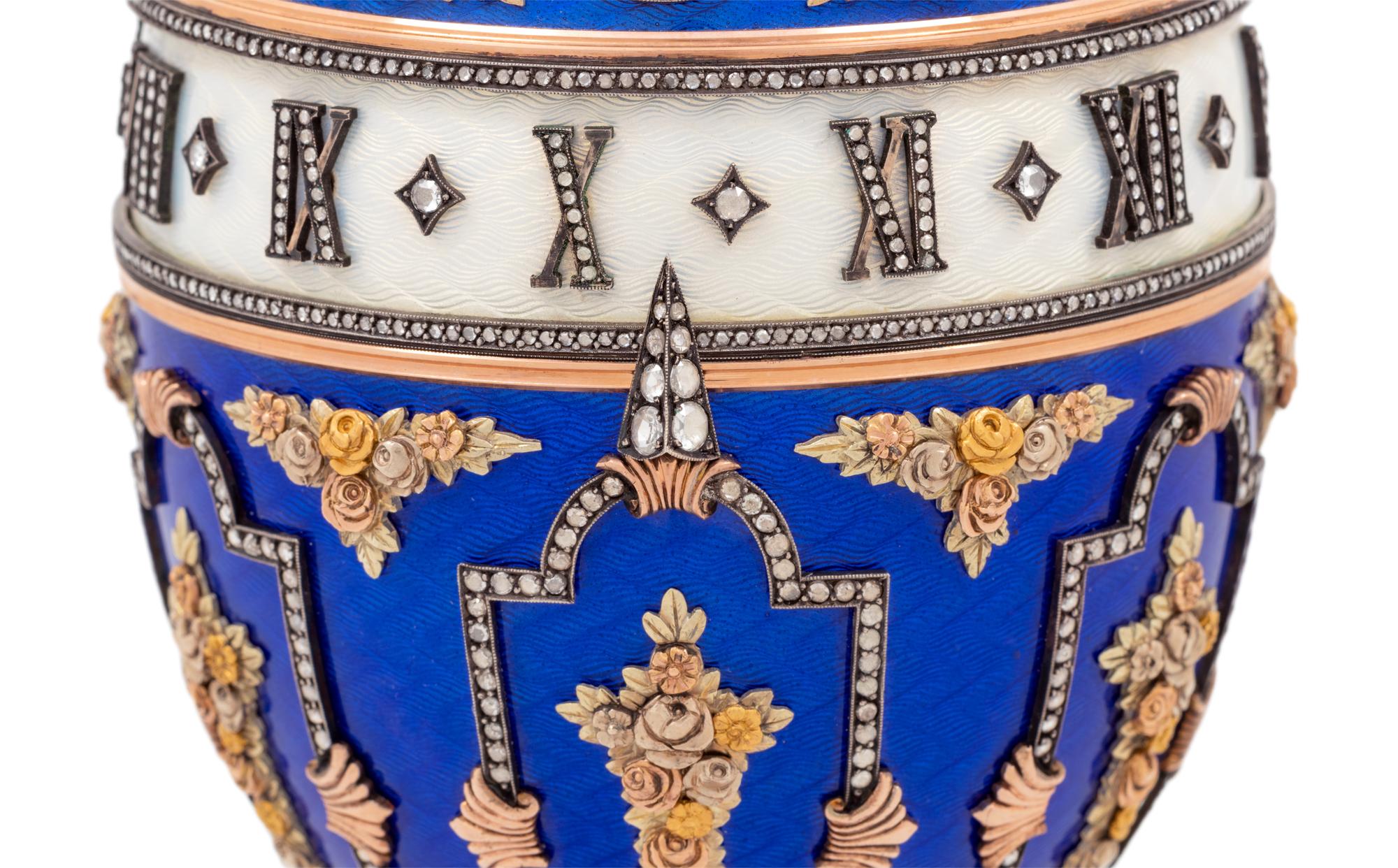 A Gold, Enamel and Diamond Inset Egg-Form Annular Clock