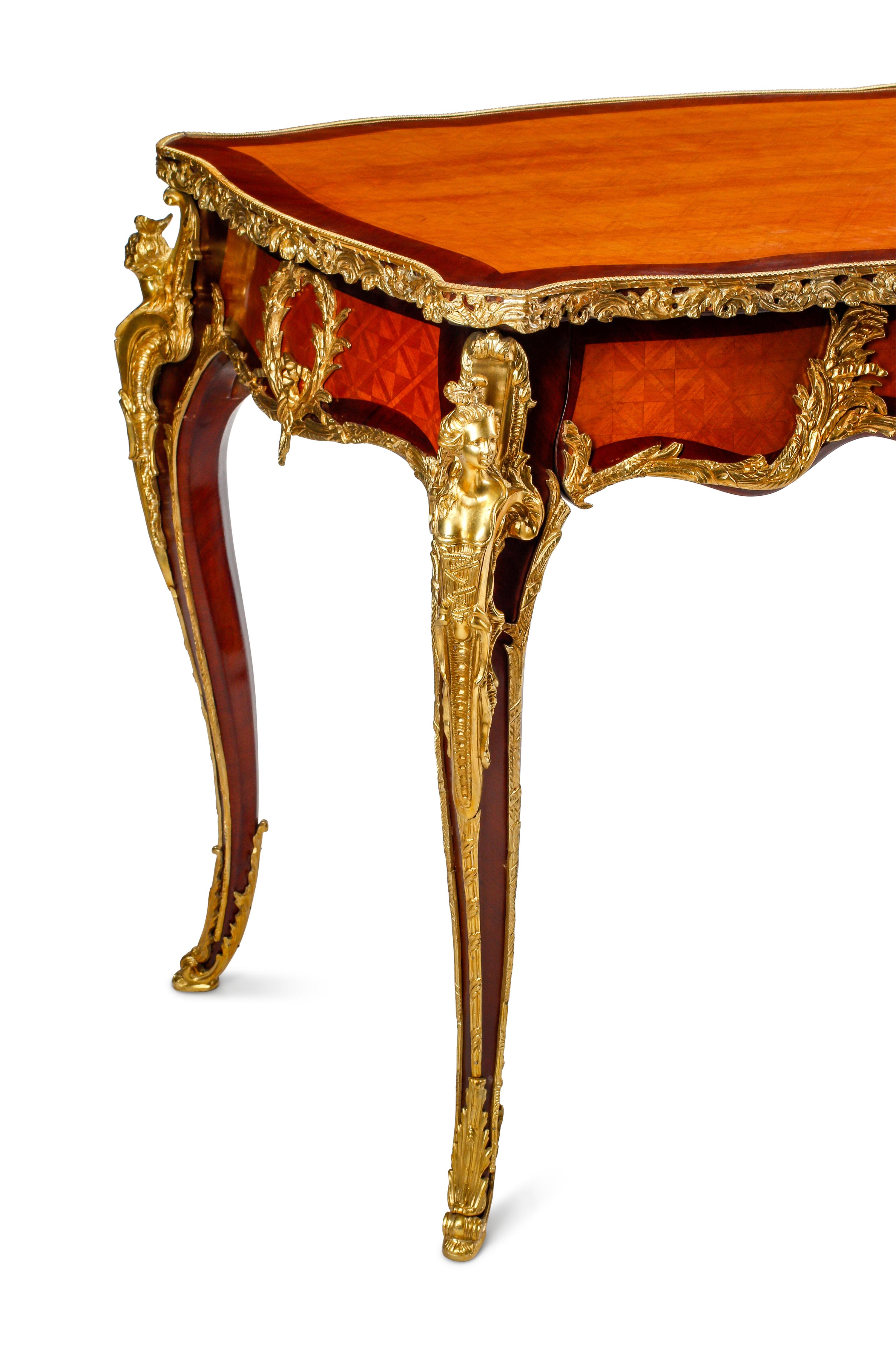 A Louis XV Style Parquetry and Gilt Bronze Mounted Bureau Plat