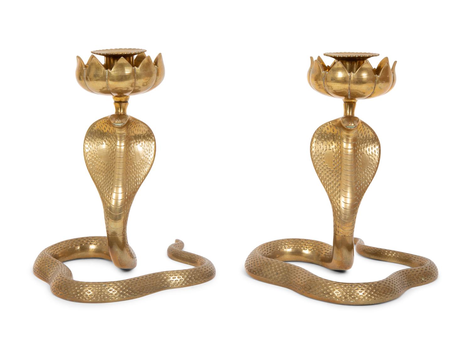 A Pair of Brass Cobra Candlesticks