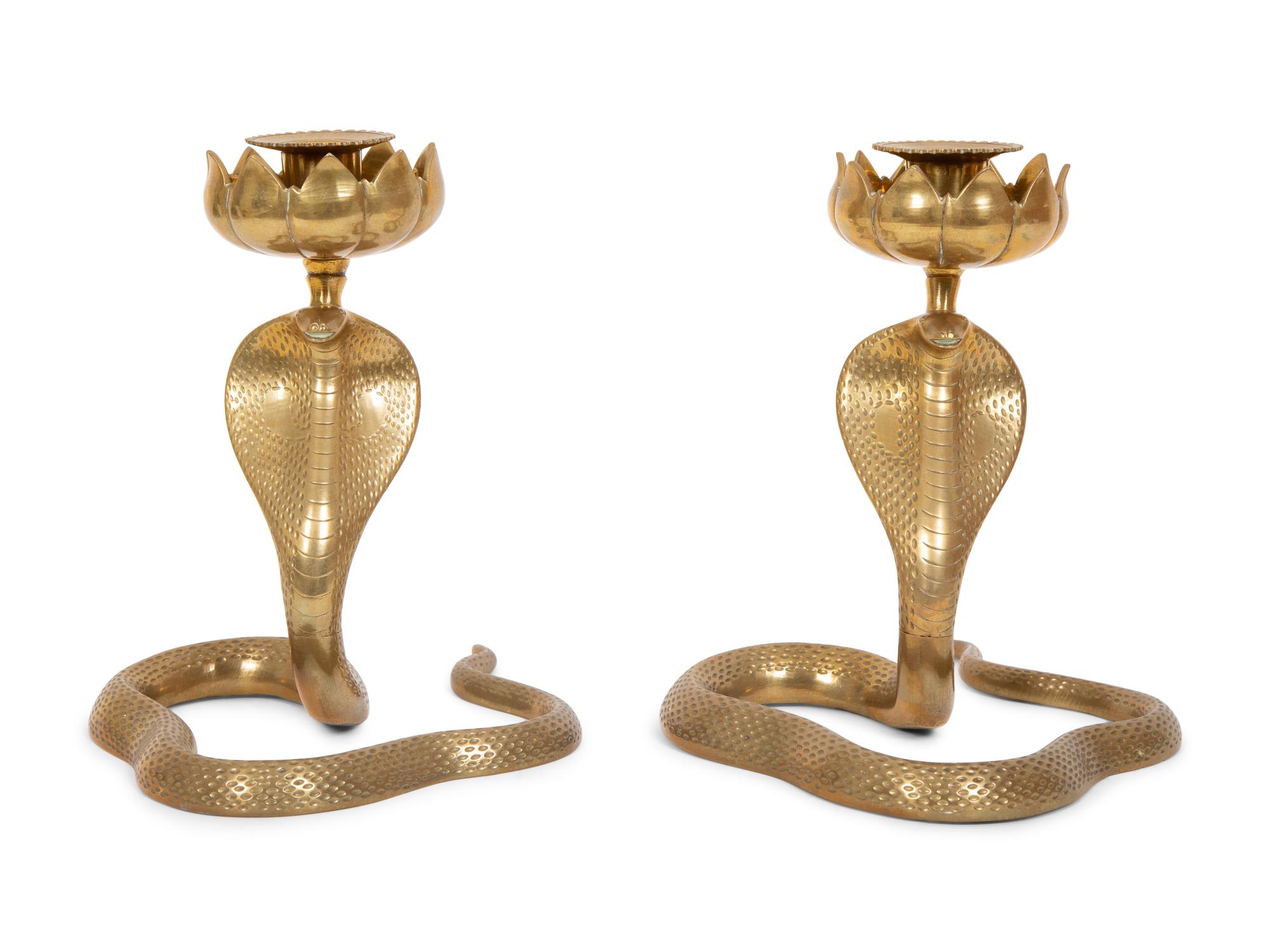 A Pair of Brass Cobra Candlesticks