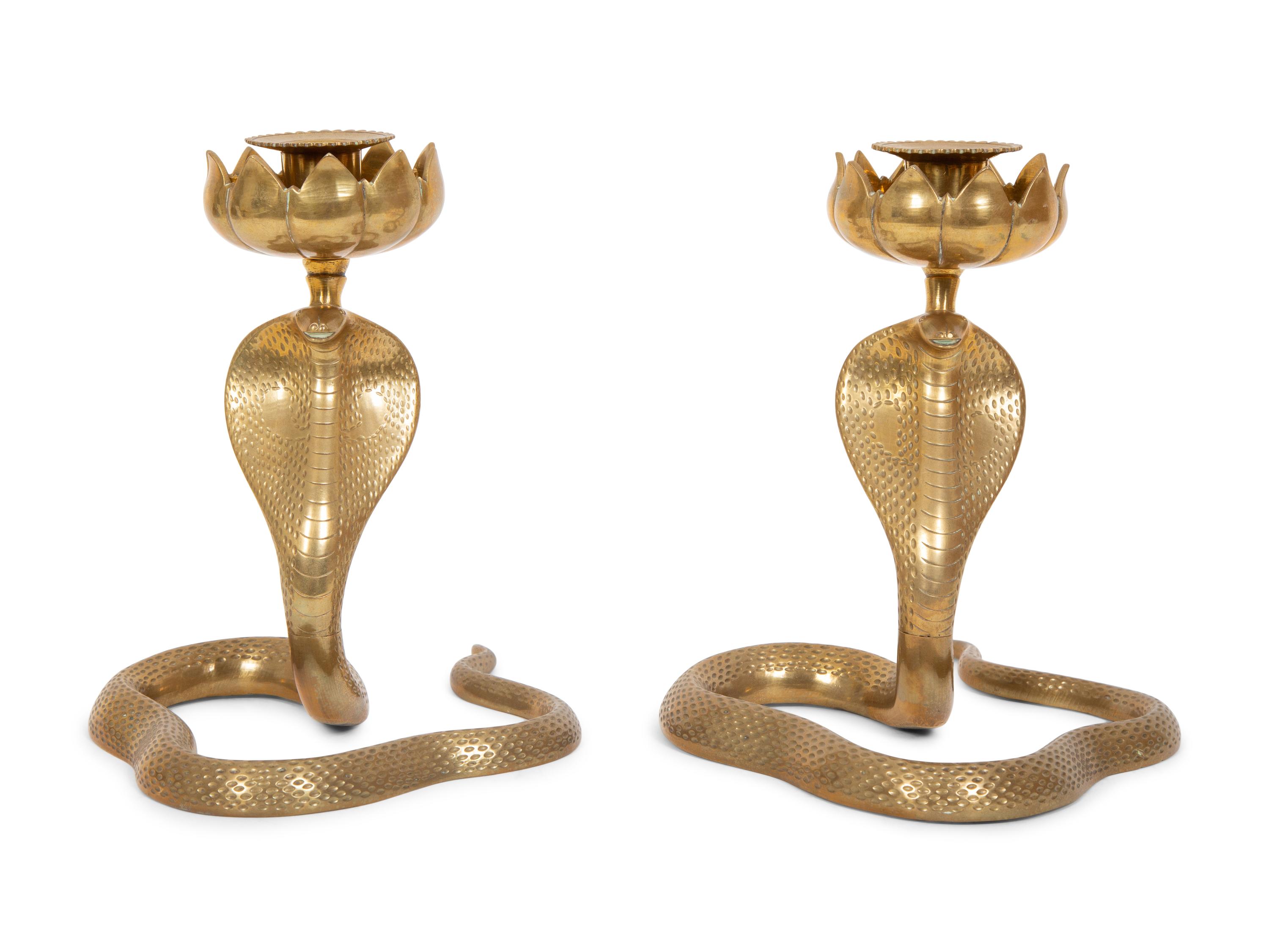 A Pair of Brass Cobra Candlesticks