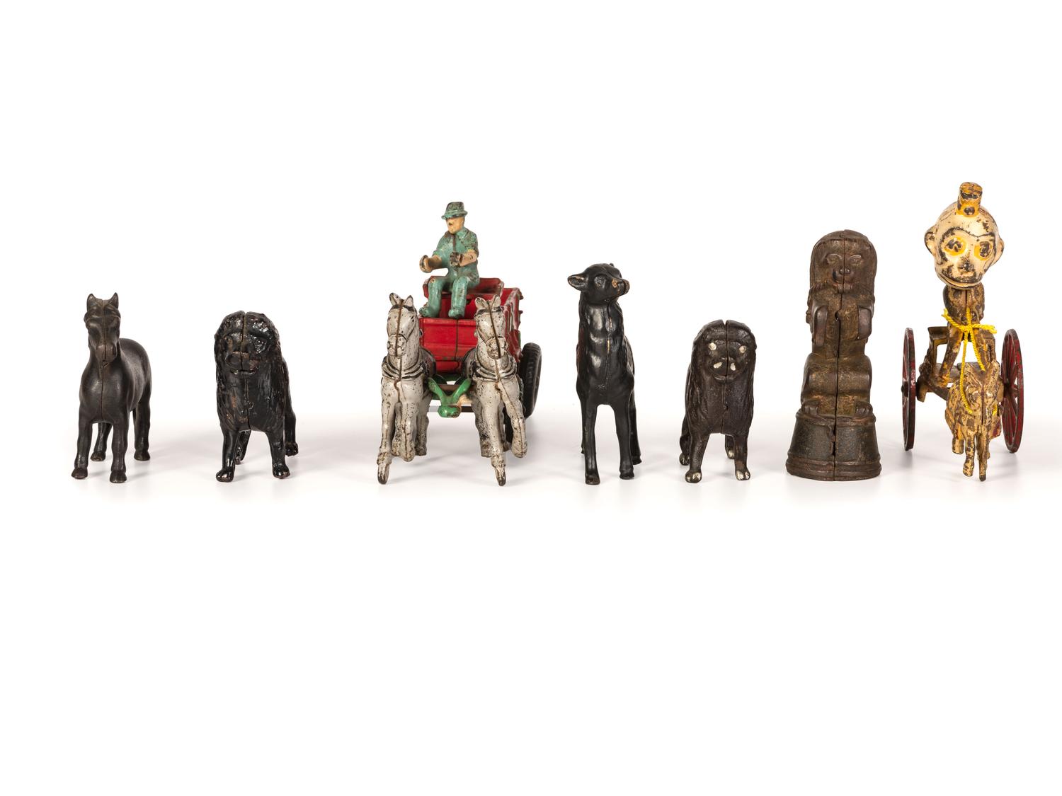 A Group of Cast Iron Banks and Pull Toys