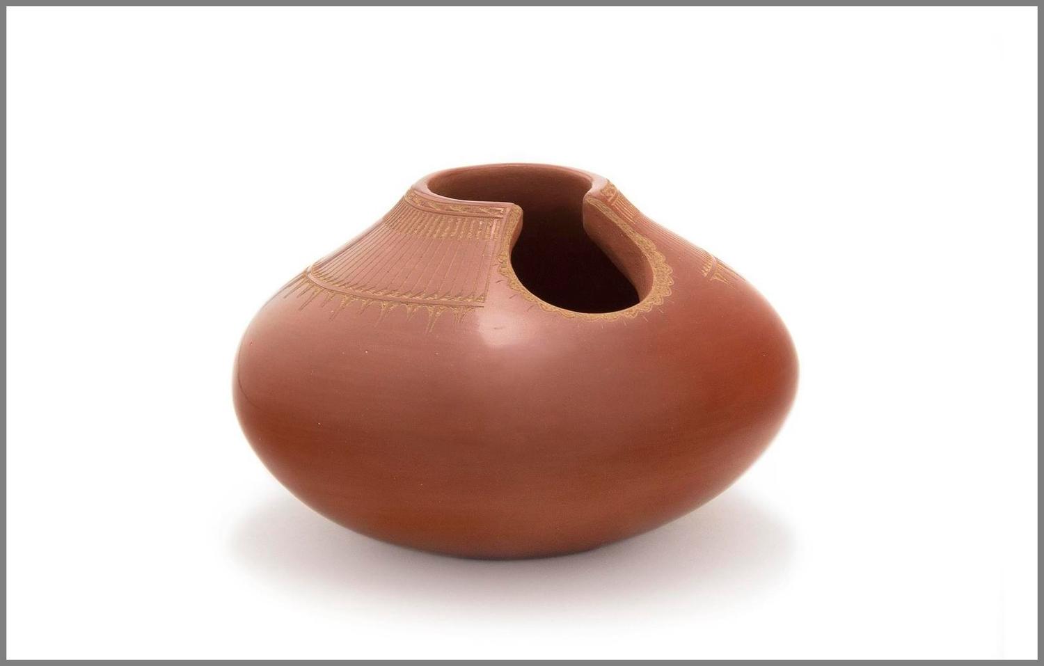 San Ildefonso Redware Vase, having carved feather design with cut out at lip