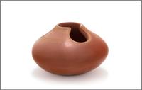 San Ildefonso Redware Vase, having carved feather design with cut out at lip