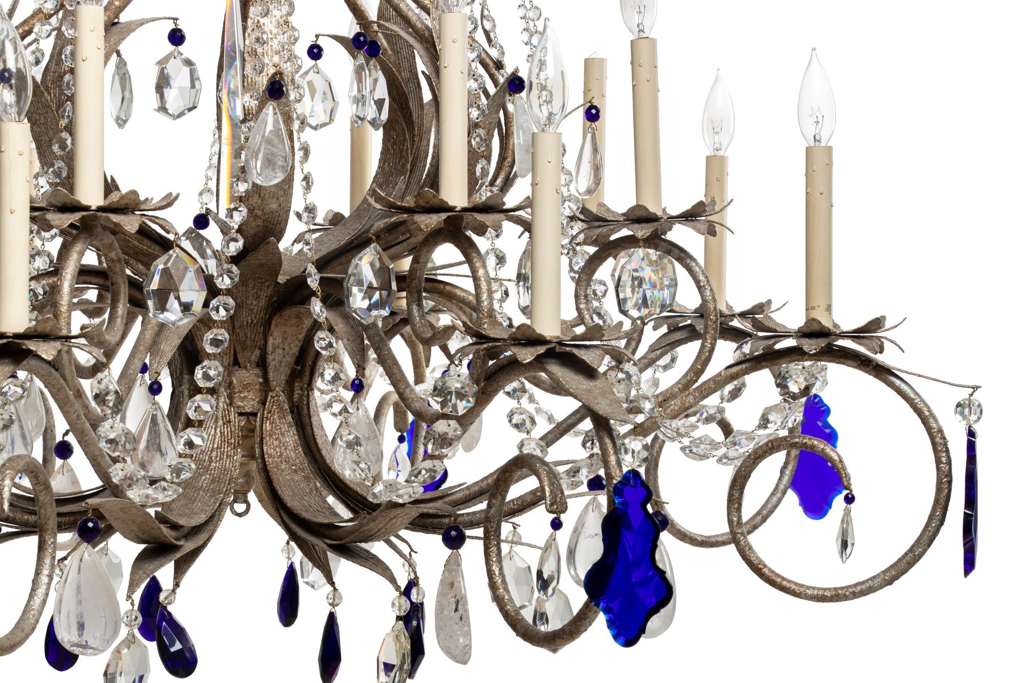 A Set of Three Large Metal and Glass Sixteen-Light Chandeliers