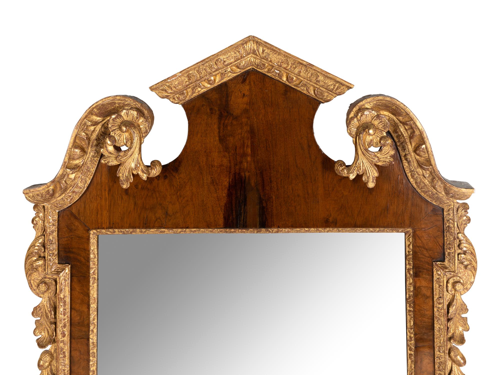 A George II Walnut and Parcel Gilt Mirror