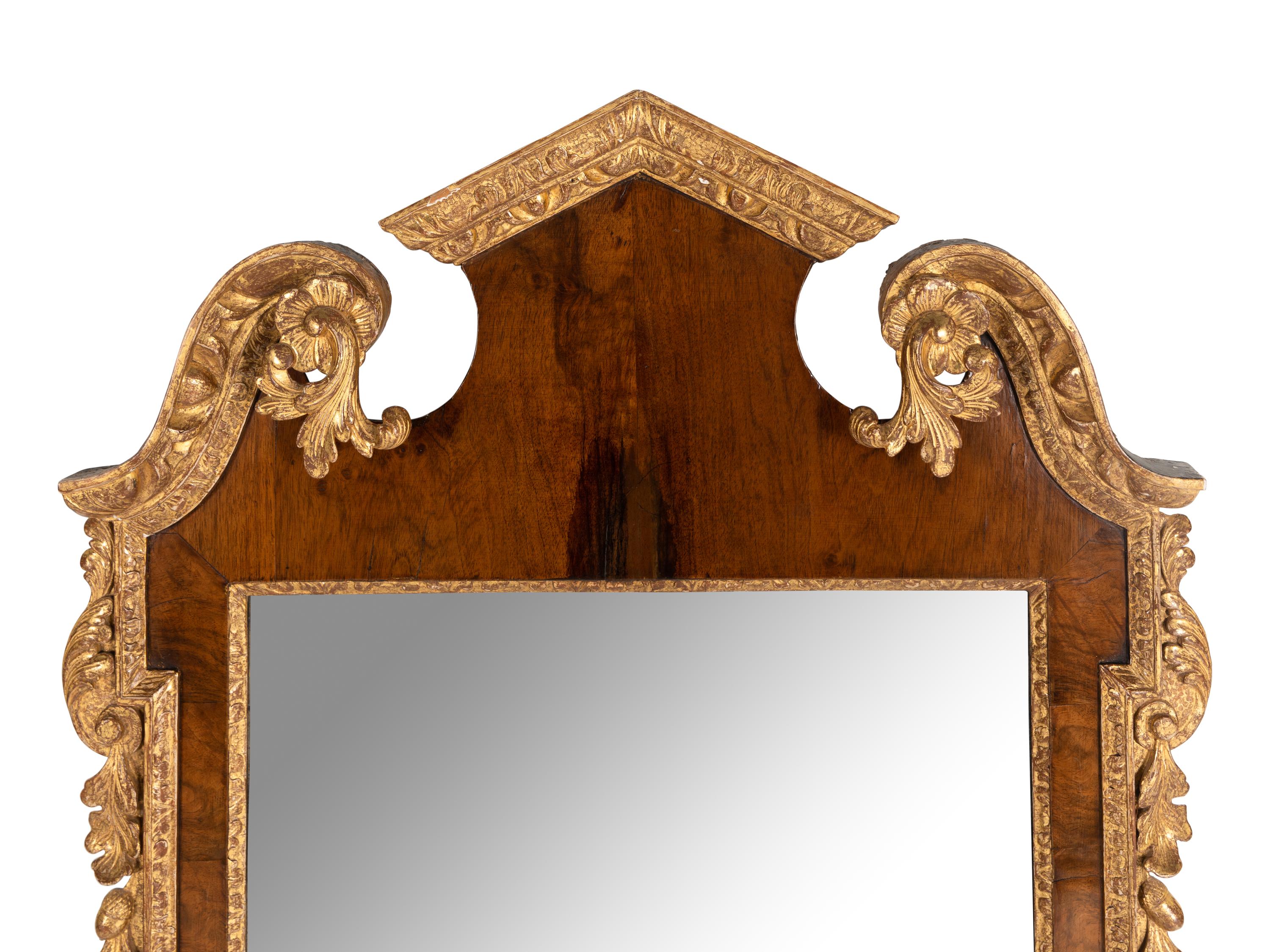 A George II Walnut and Parcel Gilt Mirror