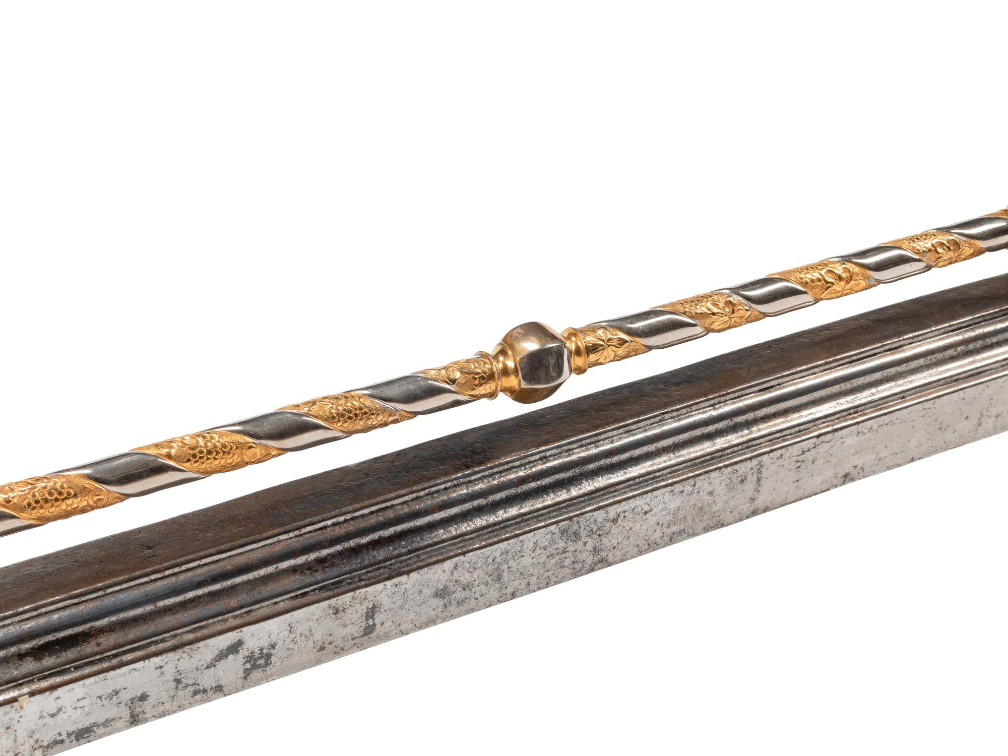 A Continental Steel and Gilt Bronze Fire Fender