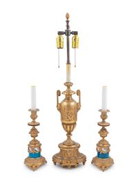 A Neoclassical Gilt Bronze Urn Mounted as a Lamp and a Pair of Porcelain Mounted Gilt Bronze Candlesticks