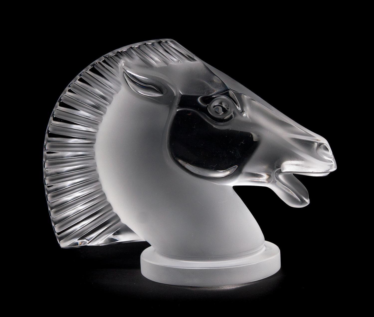 A Lalique Molded and Frosted Glass Radiator Cap, Height 4 7/8 inches.