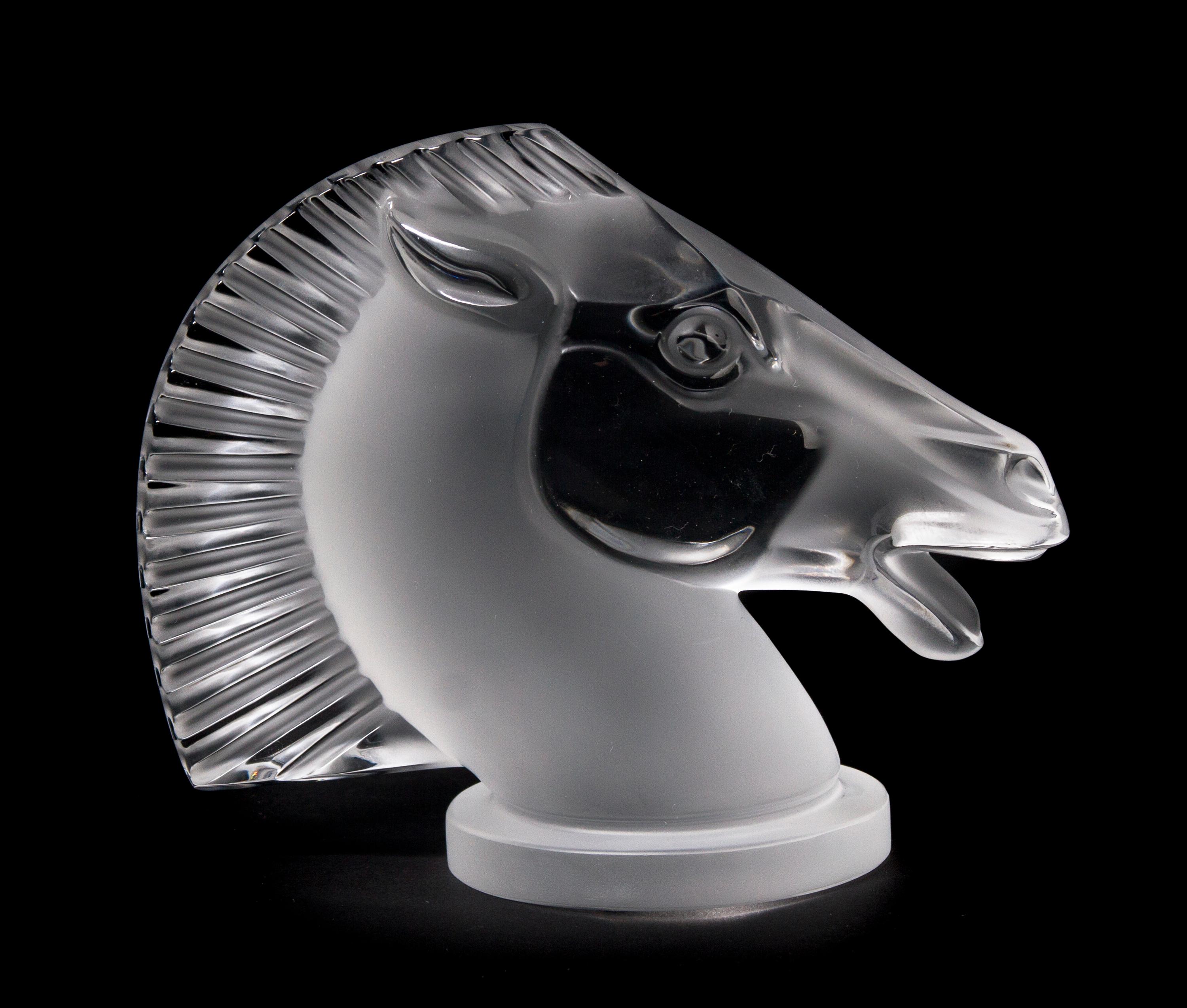 A Lalique Molded and Frosted Glass Radiator Cap, Height 4 7/8 inches.