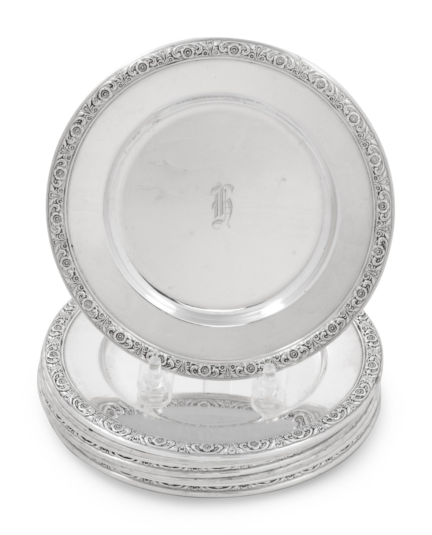 A Set of Eight International Sterling Bread Plates
