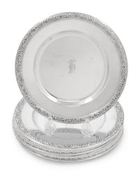 A Set of Eight International Sterling Bread Plates