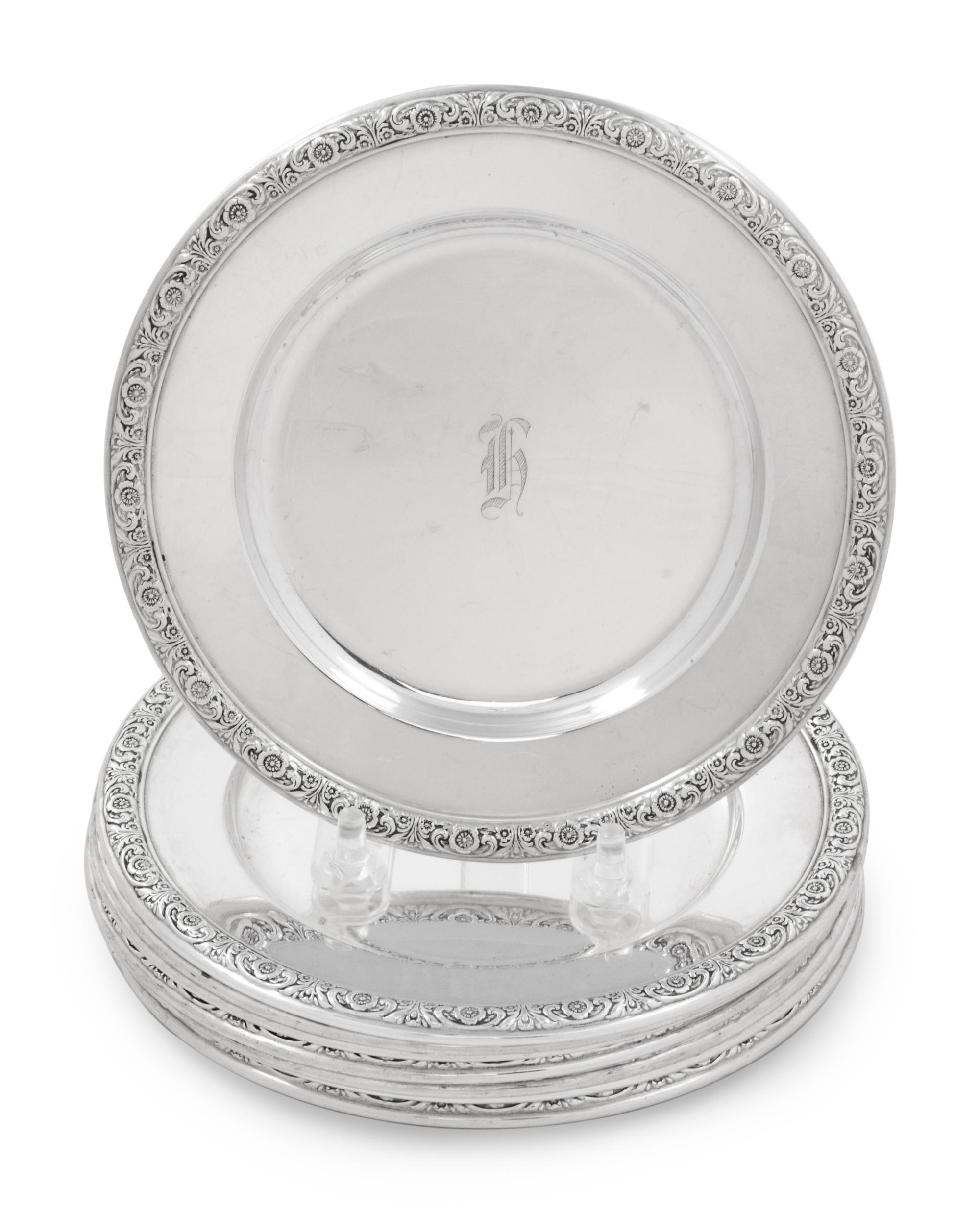 A Set of Eight International Sterling Bread Plates