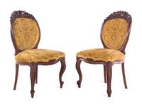 A Renaissance Revival Carved Walnut Breakfast Table and Chairs