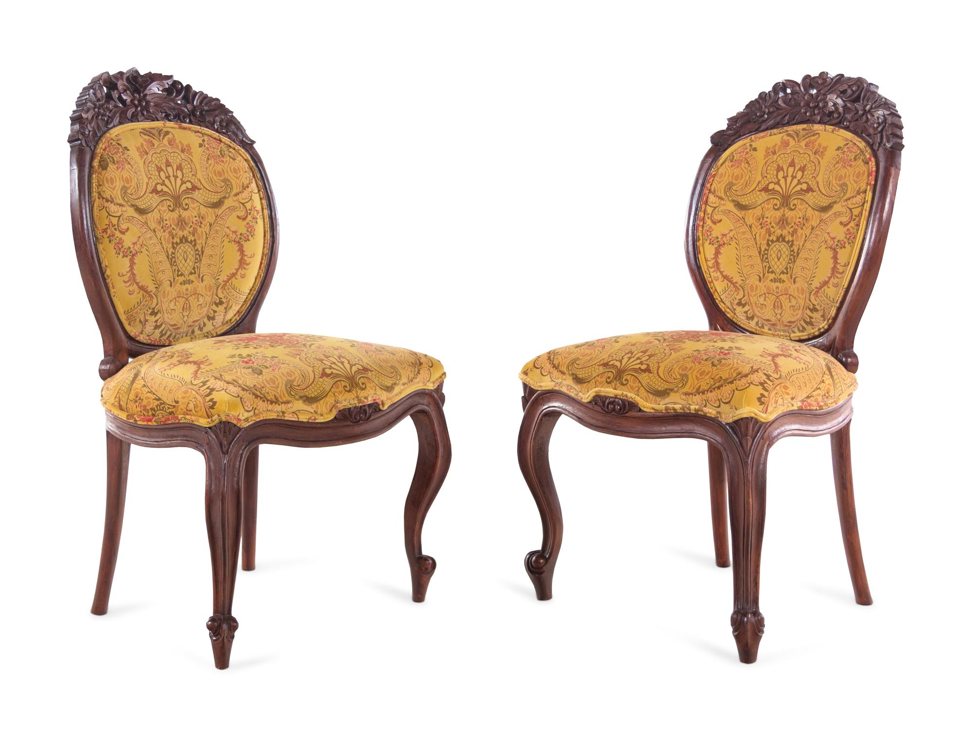 A Renaissance Revival Carved Walnut Breakfast Table and Chairs