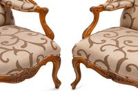 A Near Pair of Régence Style Beechwood Bergères