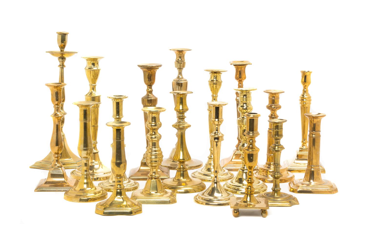 A Collection of English Brass Candlesticks, Height of tallest 13 5/8 inches.
