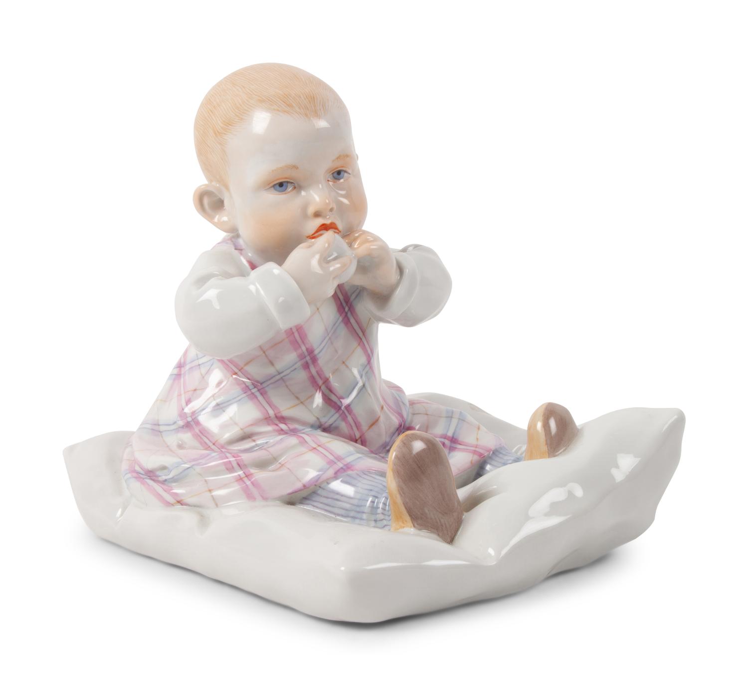 A Meissen Porcelain Figure of a Baby Feeding ,by Konrad Hentschel