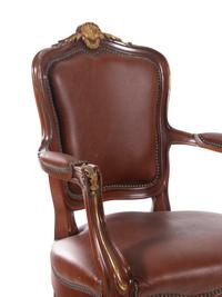 A Set of Fourteen Louis XV Style Gilt Bronze Mounted Walnut Dining Chairs