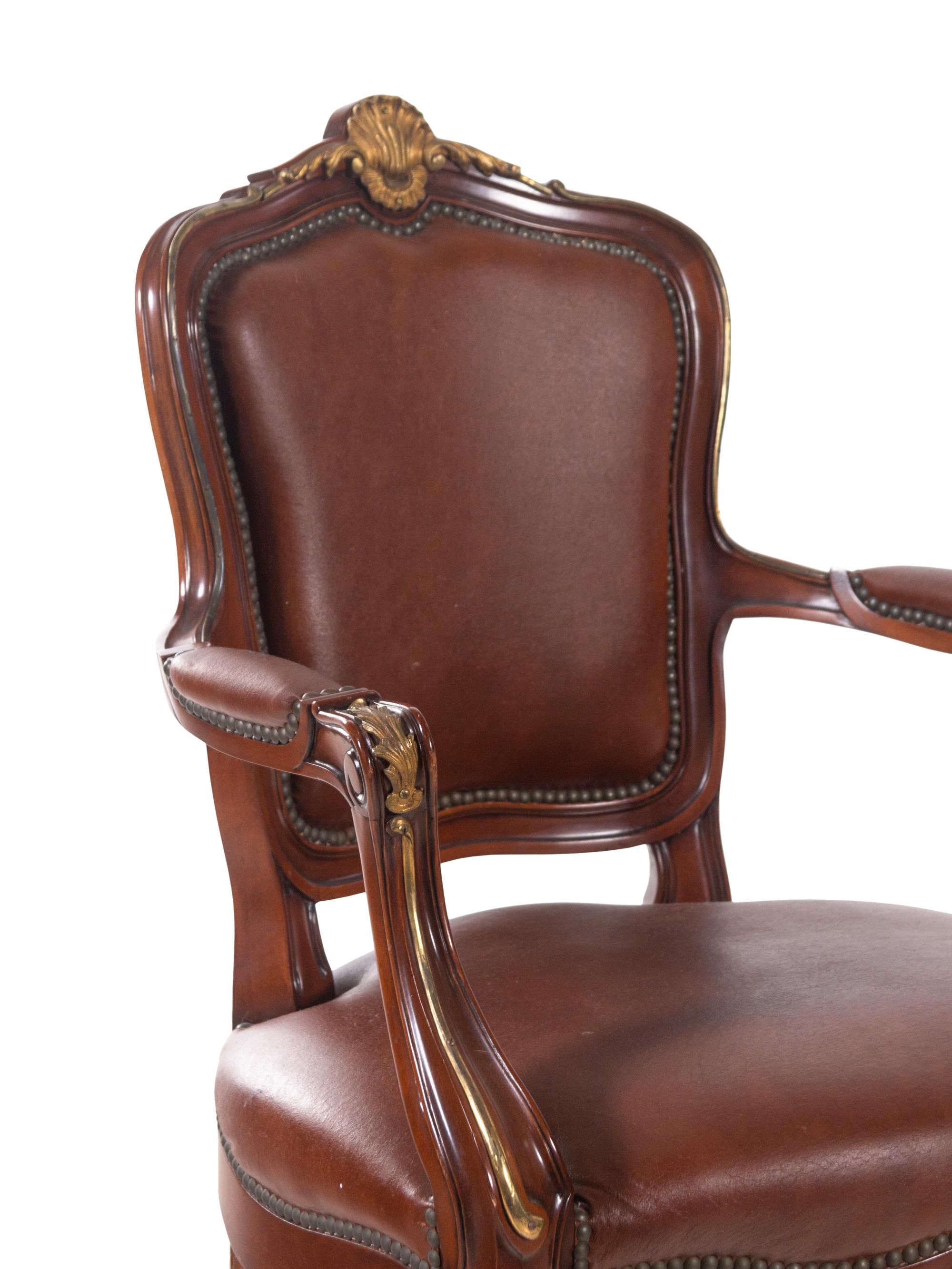 A Set of Fourteen Louis XV Style Gilt Bronze Mounted Walnut Dining Chairs