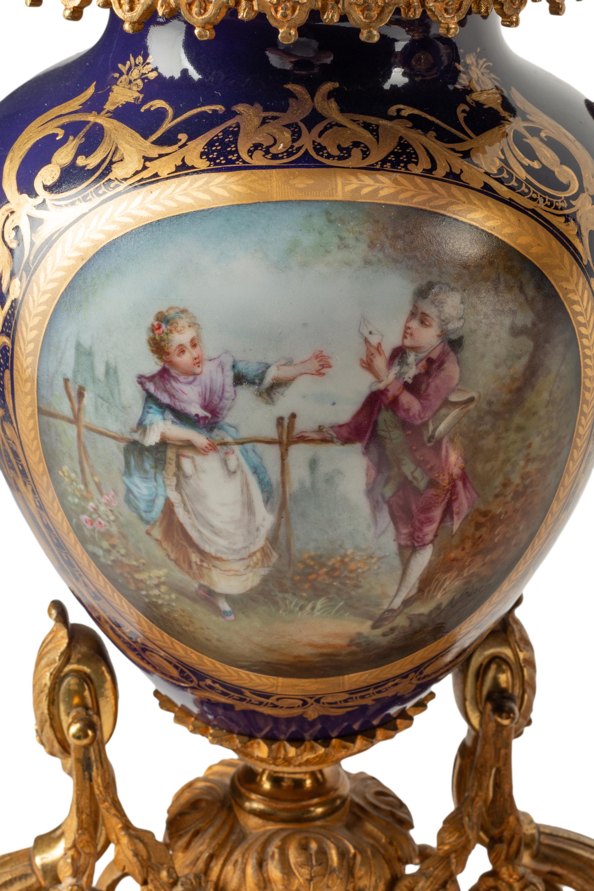 A French Gilt Bronze and Sèvres Style Porcelain Clock Garniture