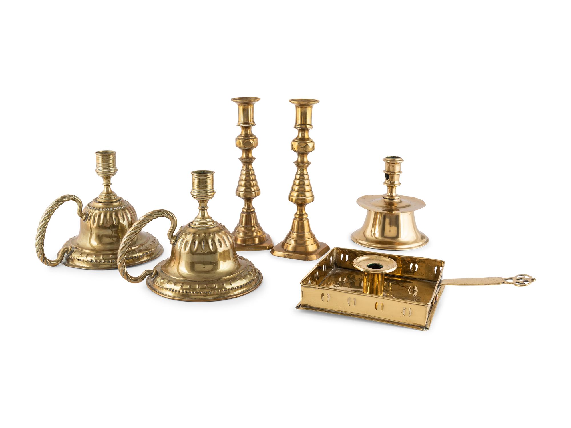 A Group of Brass Candlesticks
