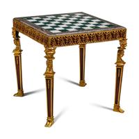An Empire Style Gilt Bronze Mounted Mahogany and Marble-Top Game Table with a Rock Crystal and Tiger's Eye Chess Set