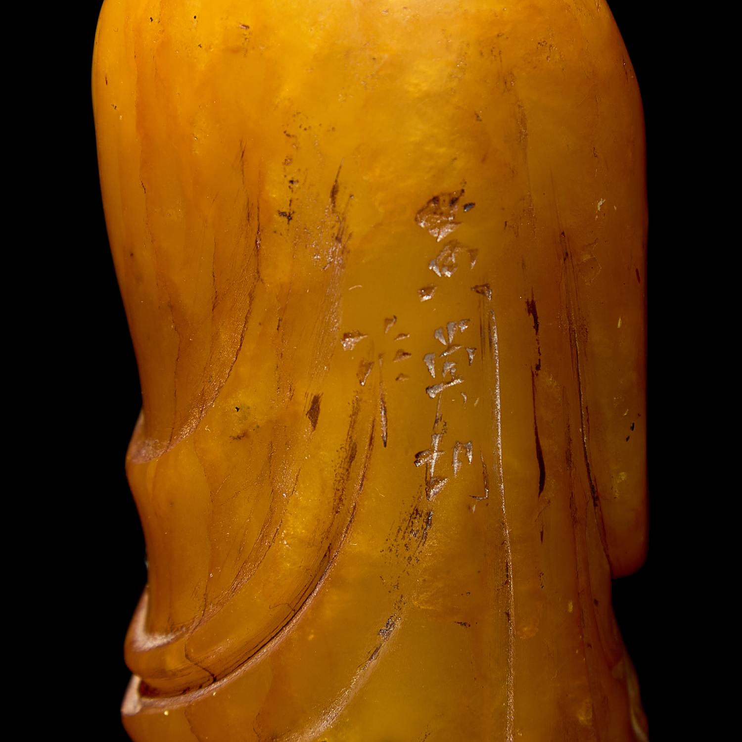 A Chinese Carved Stone "Luohan" Seal and a Yellow "Peking" Glass Bowl 壽山石雕羅漢和黃料花卉紋盌各一
