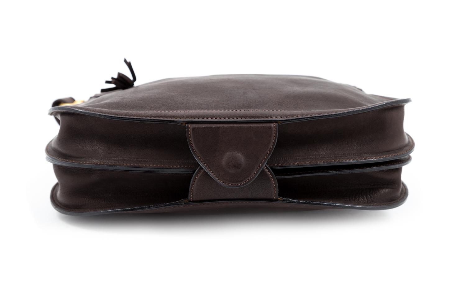 A Gucci Brown Leather Vintage Reversible Saddle Shoulder Bag, 9.75" H x 10.75" W x 2" D; Strap drop: 8.5"- 9".
