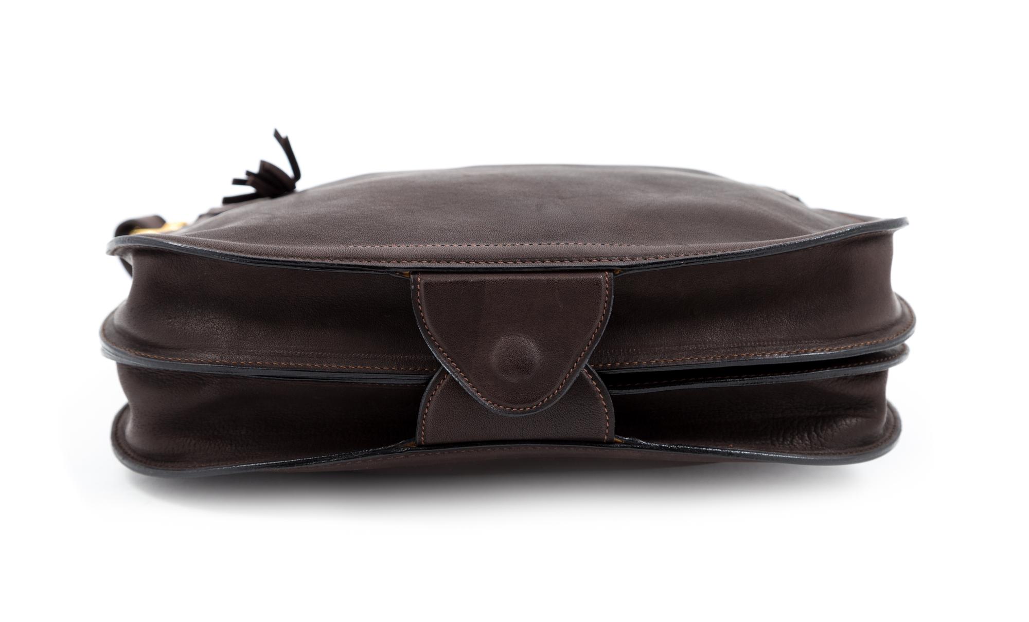 A Gucci Brown Leather Vintage Reversible Saddle Shoulder Bag, 9.75" H x 10.75" W x 2" D; Strap drop: 8.5"- 9".