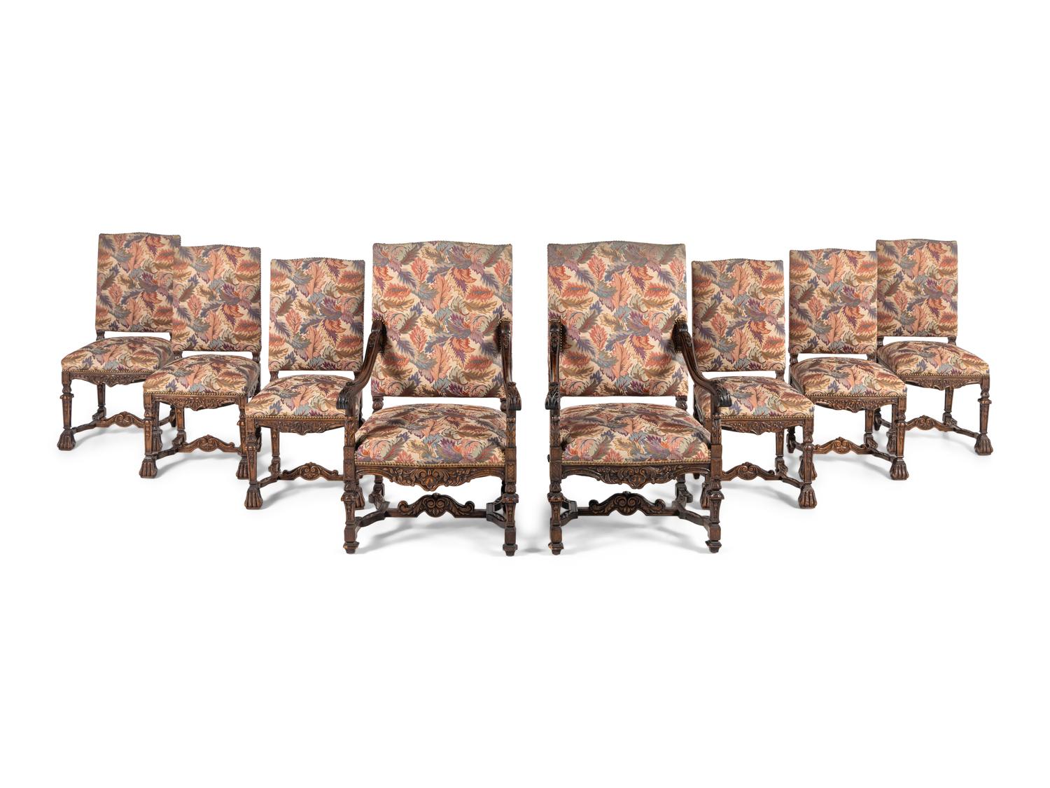 A Set of Eight Renaissance Style Carved Walnut Dining Chairs