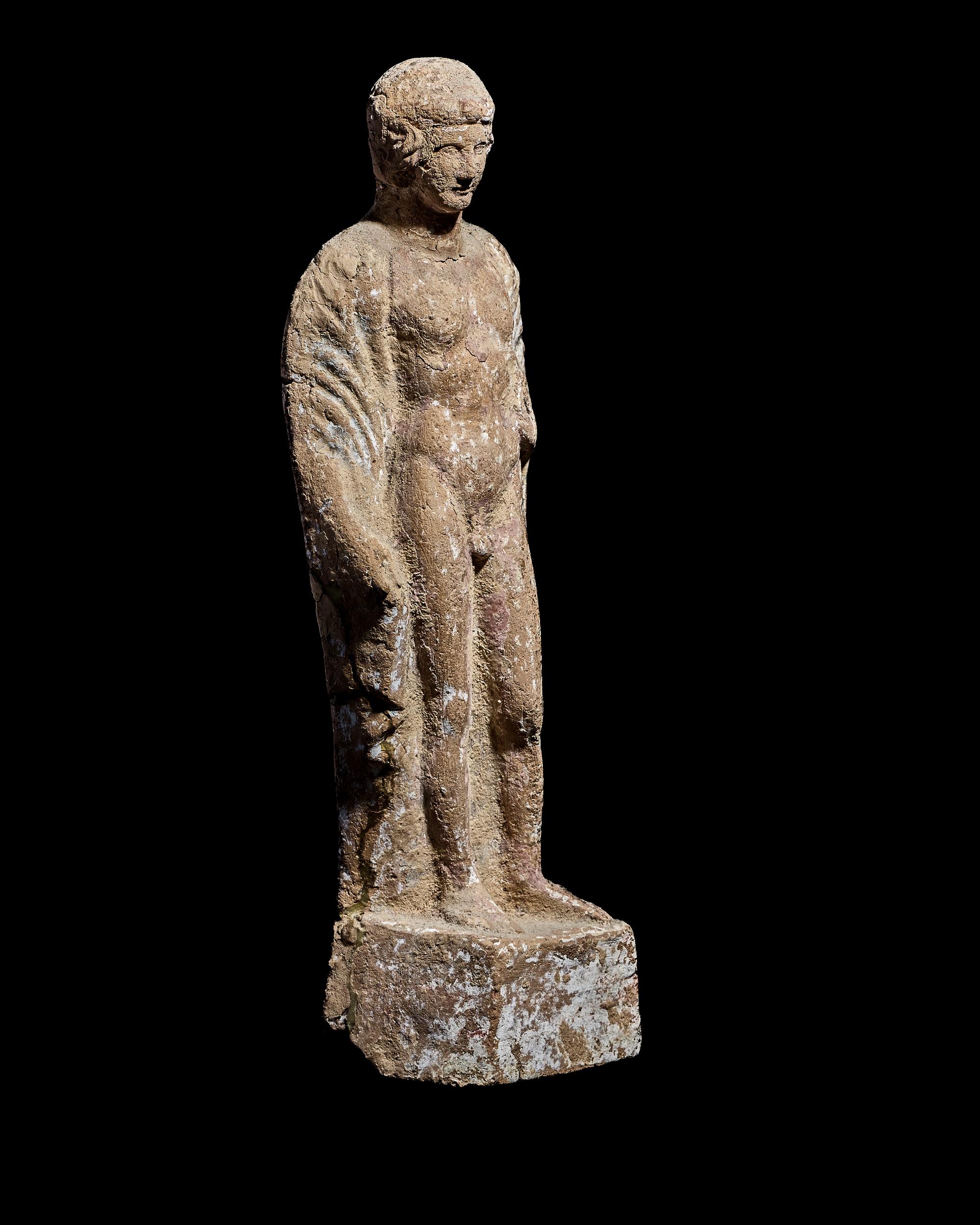 A Boeotian Terracotta Standing Youth with a Cock