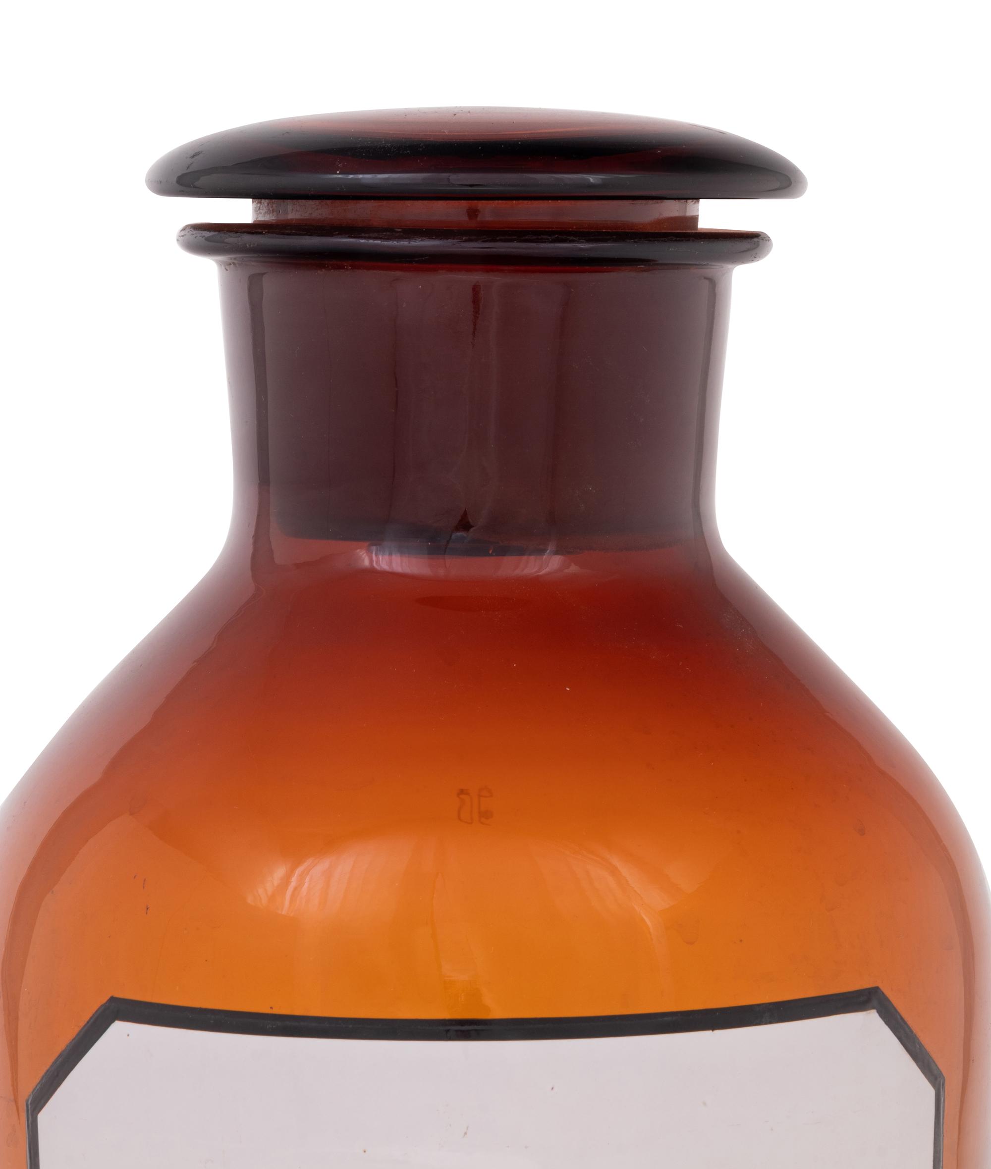 A Set of Three Large Amber Glass Apothecary Jars