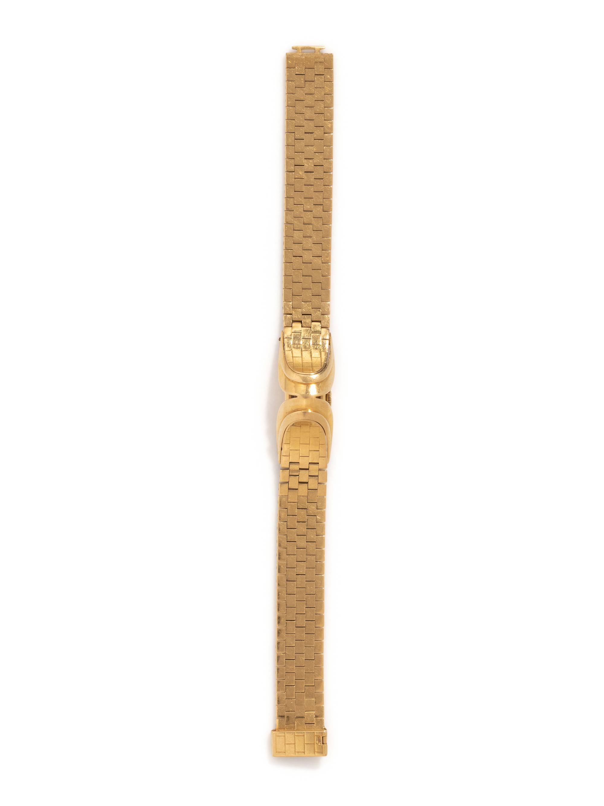 GÜBELIN, 18K YELLOW GOLD SURPRISE WATCH