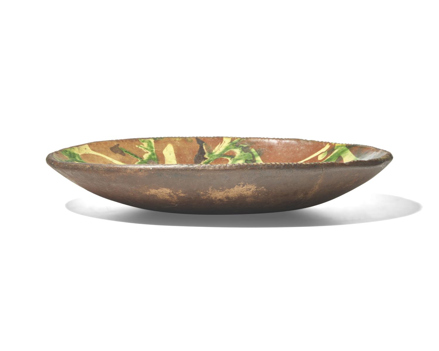 A Large Oval Slip-Decorated Redware Dish, Pennsylvania, Late 18th Century
