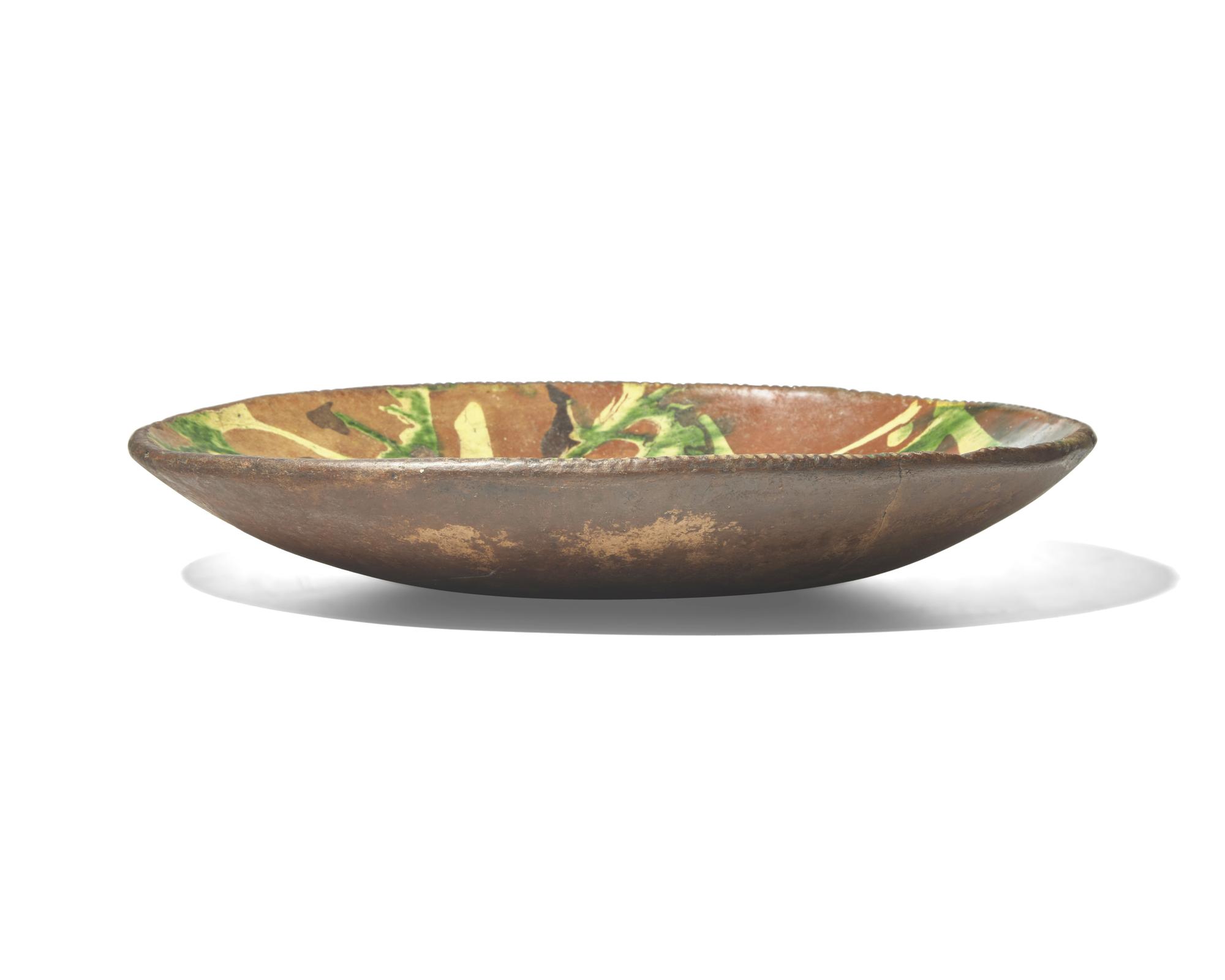 A Large Oval Slip-Decorated Redware Dish, Pennsylvania, Late 18th Century