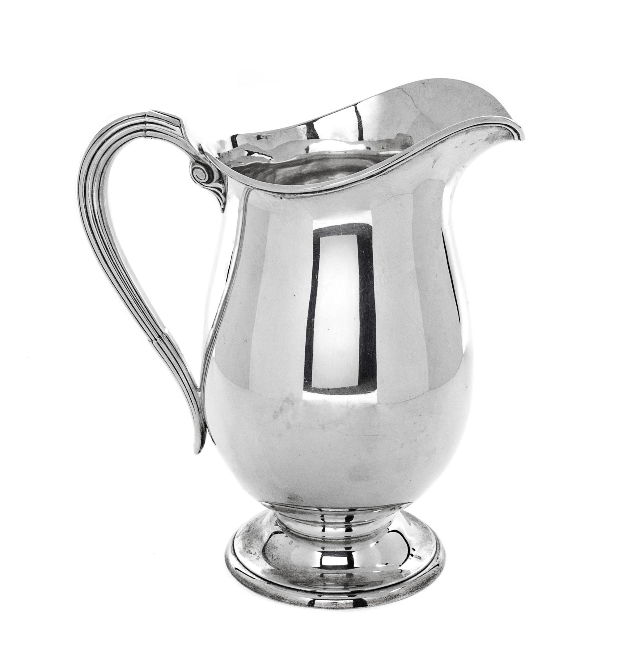 An American Silver Pitcher, International Silver Co., Meriden, CT, with reeded handle.