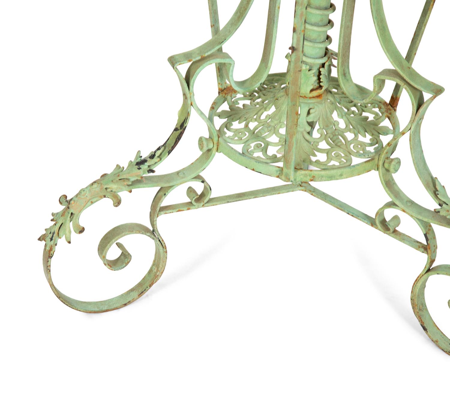 A Fornasetti Citta di Carte Table Top on Painted Wrought Iron Base