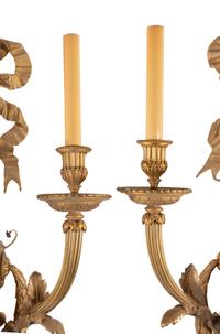 A Set of Eight Louis XVI Style Gilt Bronze Three-Light Sconces