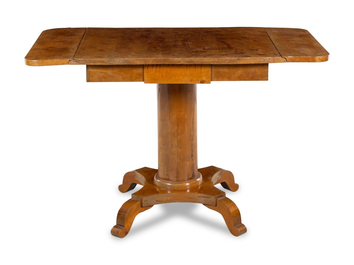 A Biedermeier Walnut Drop-Leaf Center Table
