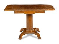 A Biedermeier Walnut Drop-Leaf Center Table