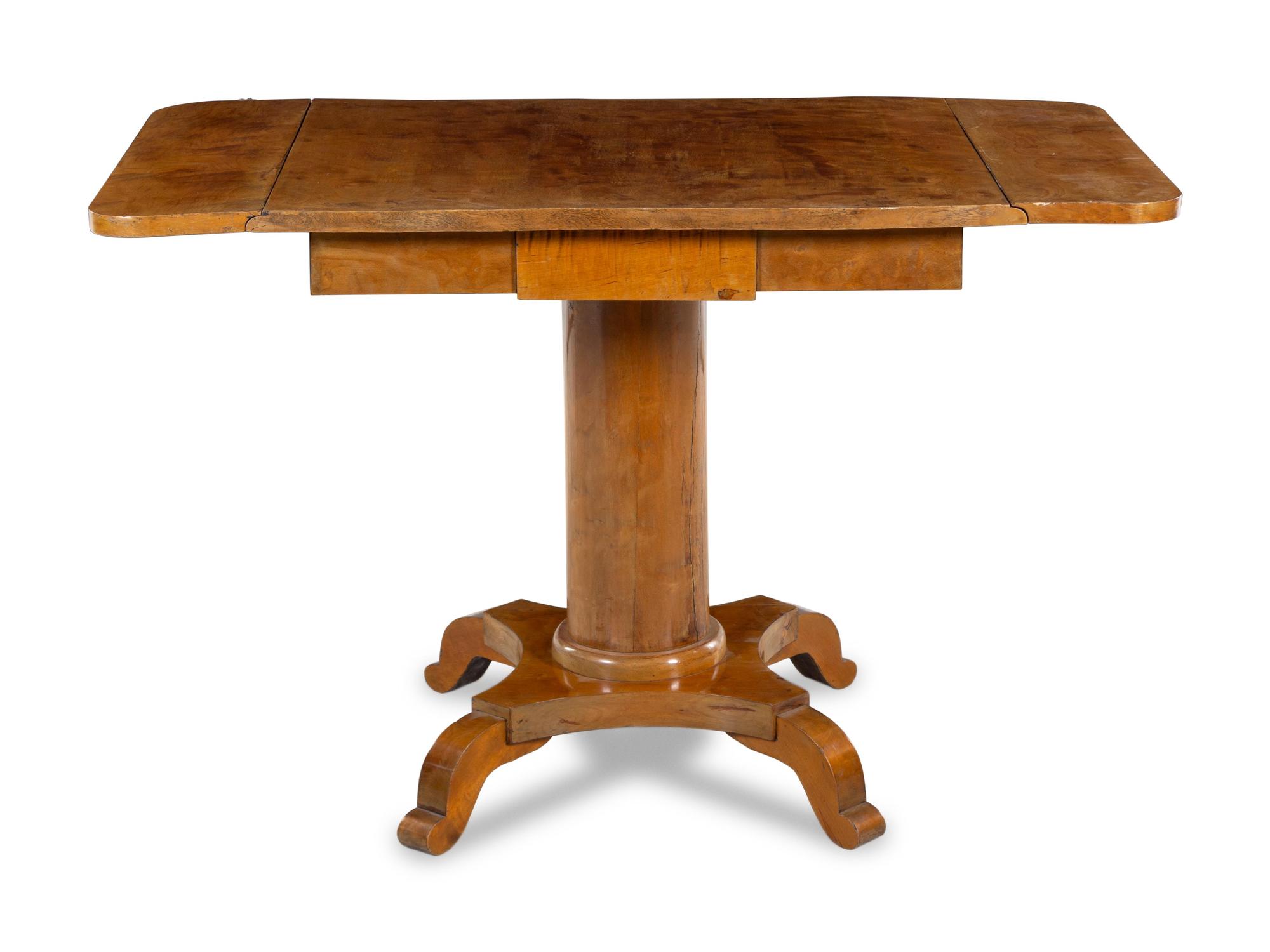 A Biedermeier Walnut Drop-Leaf Center Table