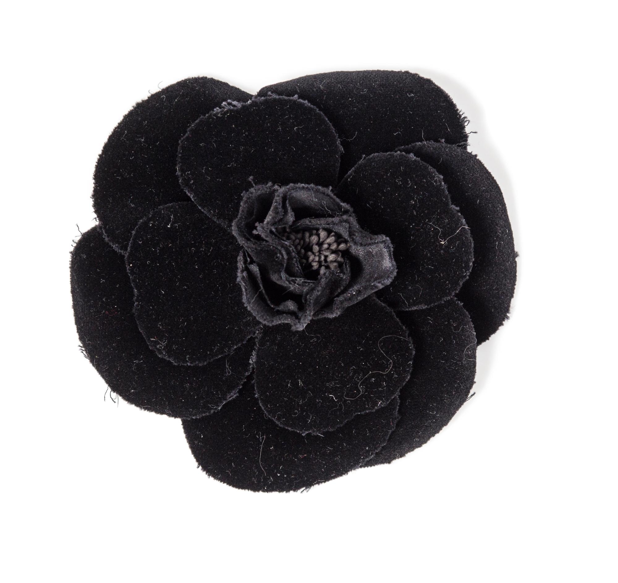A Chanel Black Velvet Camelia Brooch, 4.5" x 4.5".